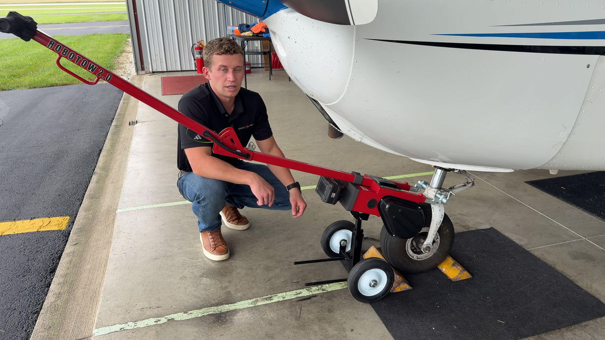 The Dolly Wheel 2.0 under the drive end of a Robotow 2.0 hooked to a nose wheel.
