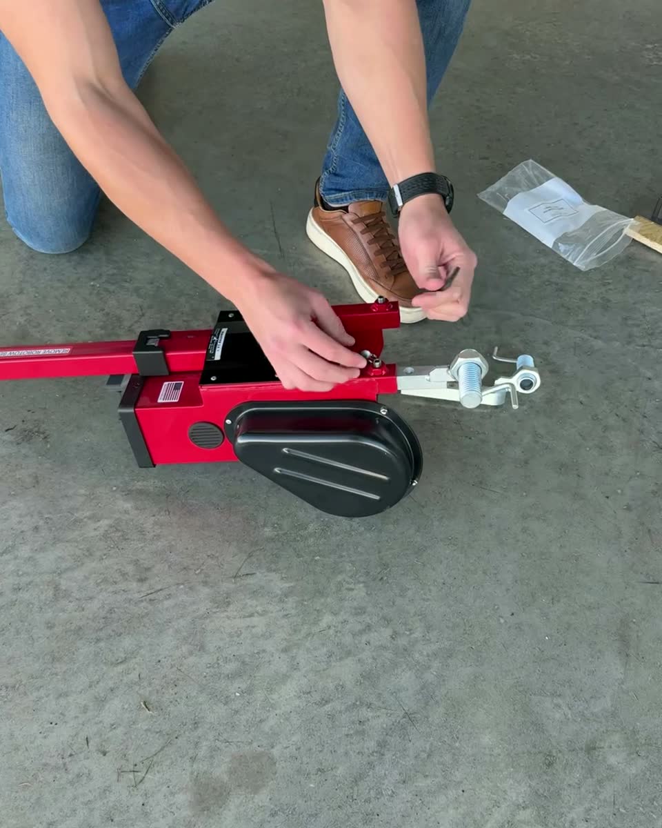 Hands fitting the Cessna 1 adapter into the Robotow forks.