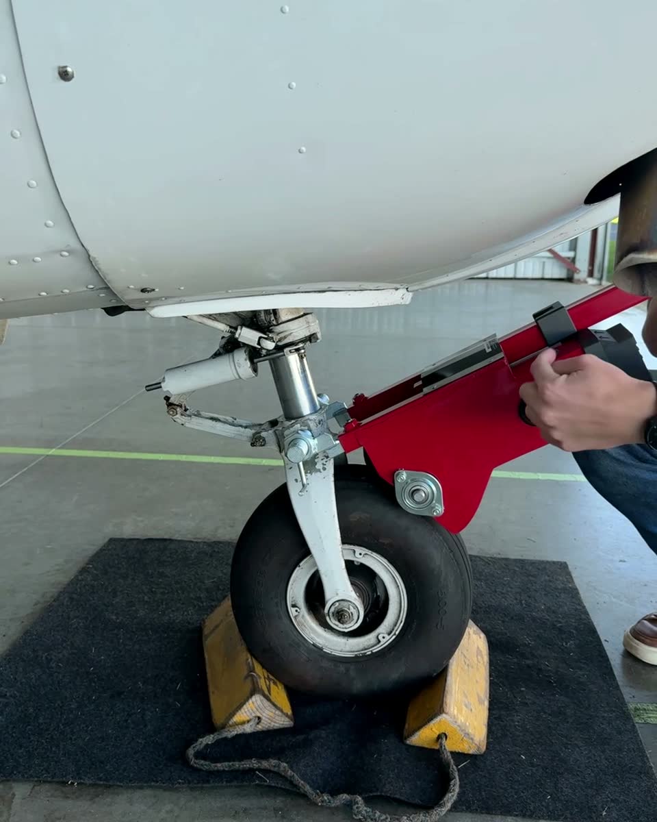 The Robotow drum against a Cessna 172 nose tire with the adapter on the fork.