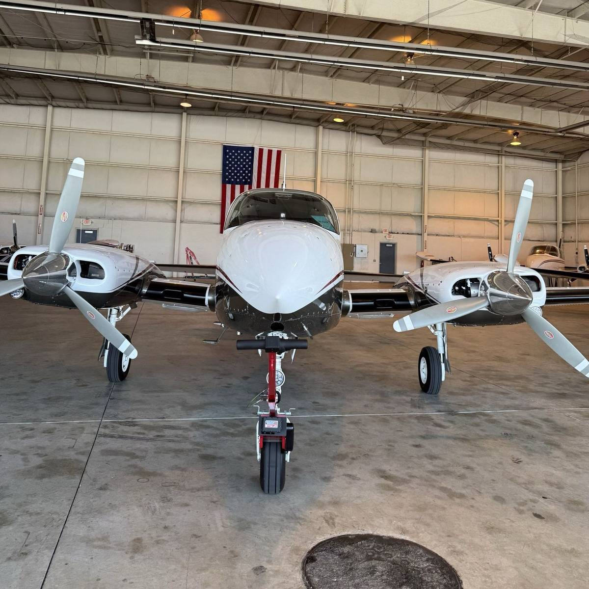 Robotow 2.0 Pro on a Cessna 310RG nose gear in the hangar.