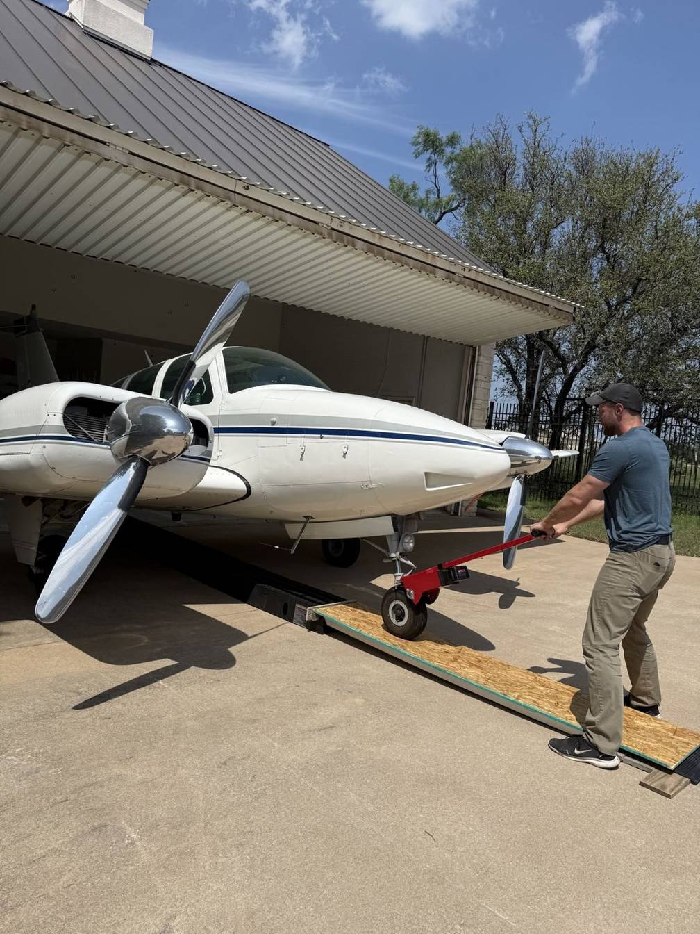 A Beechcraft Baron pulled up a ramp into its hangar with a Robotow 2.0, Marble Falls, Texas.
