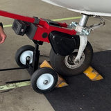 The Dolly Wheel 2.0 under the drive end of a Robotow 2.0, hooked to a nose wheel.